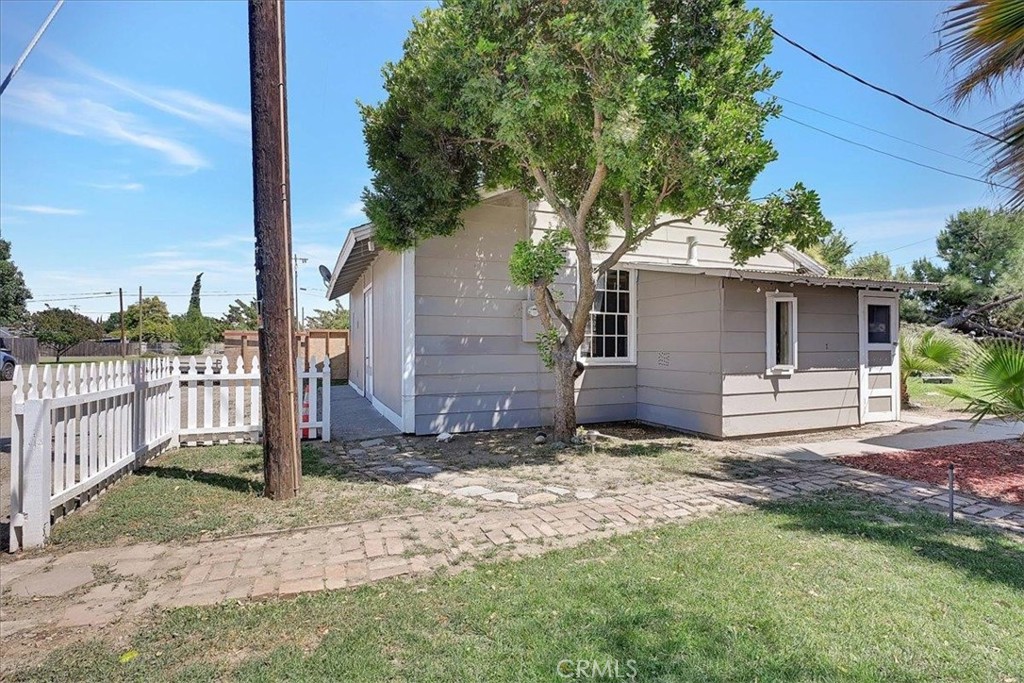 1732 Wescott Road Colusa, CA 95932 - Photo 49 of 56 a view of a barn house next to a yard with wooden fence