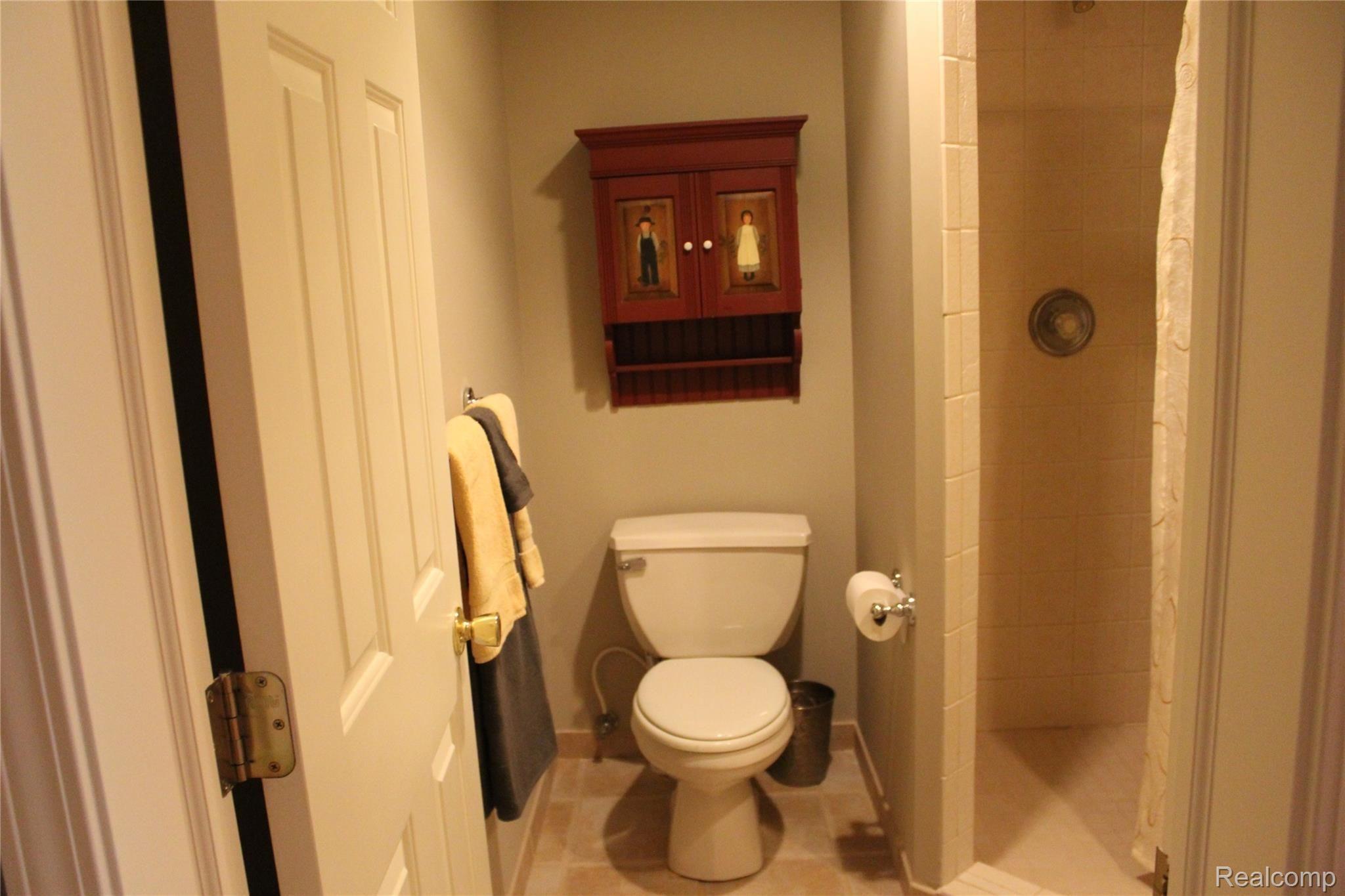 2670 East Wardlow Road Highland, MI 48356 - Photo 38 of 99 3 piece basement bathroom, full ceramic shower