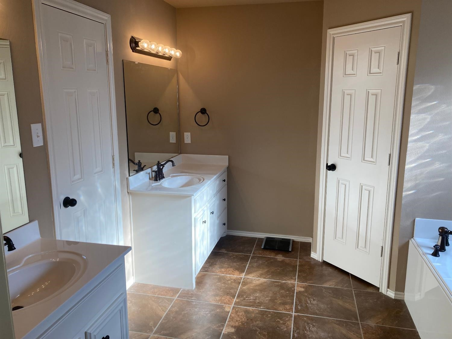 6120 75th Place Lubbock, TX 79424 - Photo 15 of 30 a bathroom with a sink and a mirror