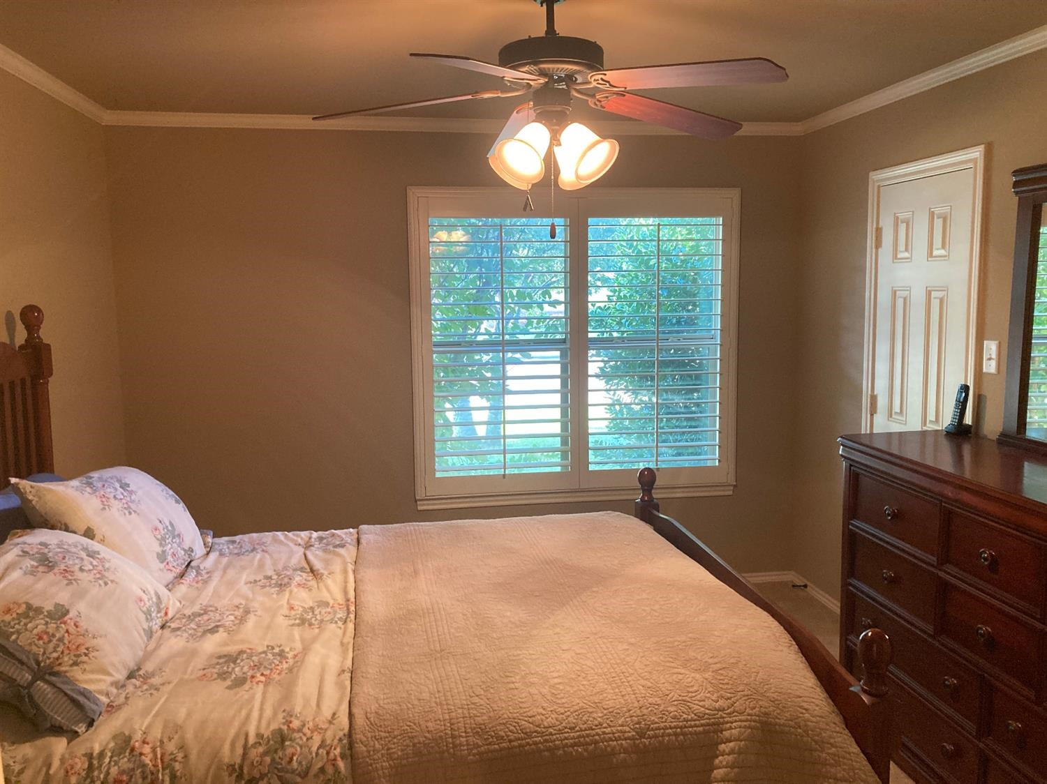 6120 75th Place Lubbock, TX 79424 - Photo 19 of 30 a bedroom with a bed and a window