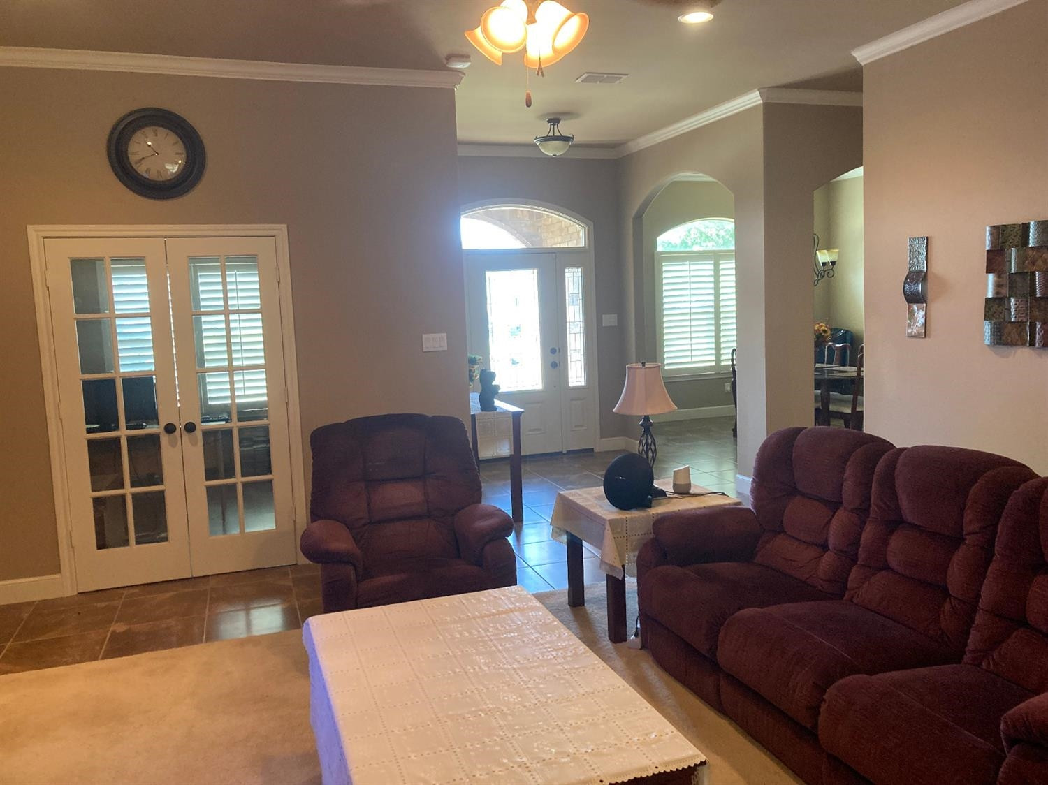 6120 75th Place Lubbock, TX 79424 - Photo 3 of 30 a living room with furniture a chandelier and a large window