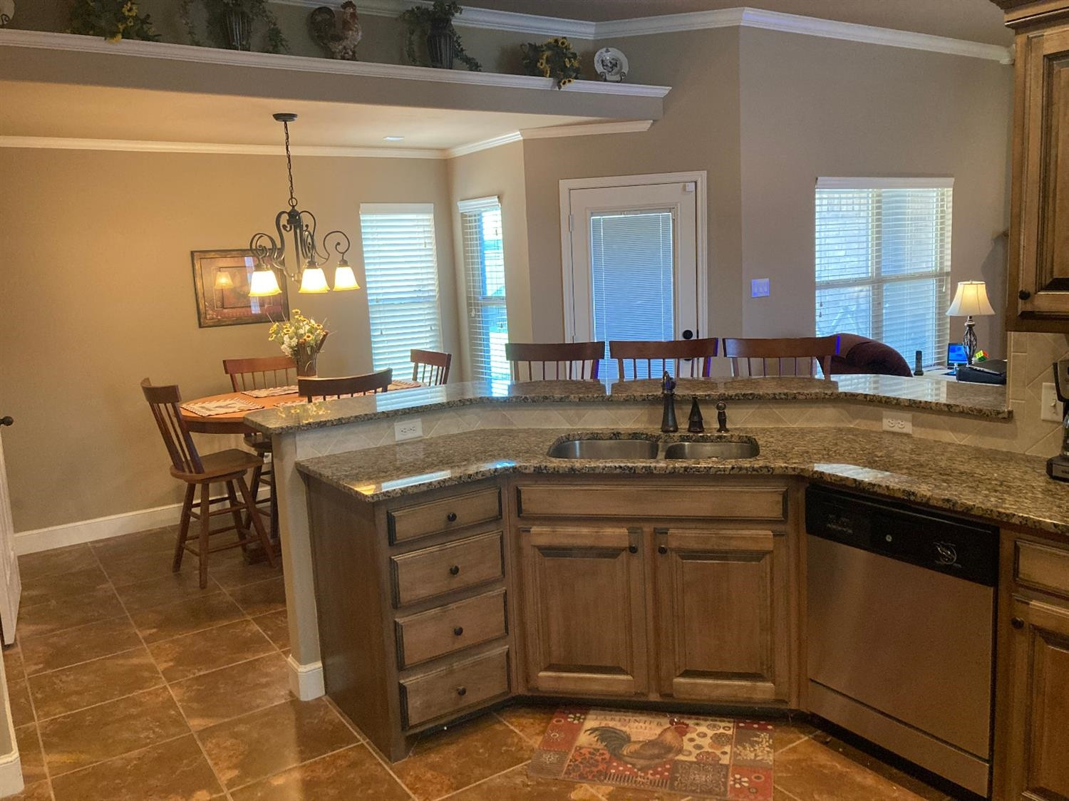 6120 75th Place Lubbock, TX 79424 - Photo 7 of 30 a kitchen with a sink and cabinets