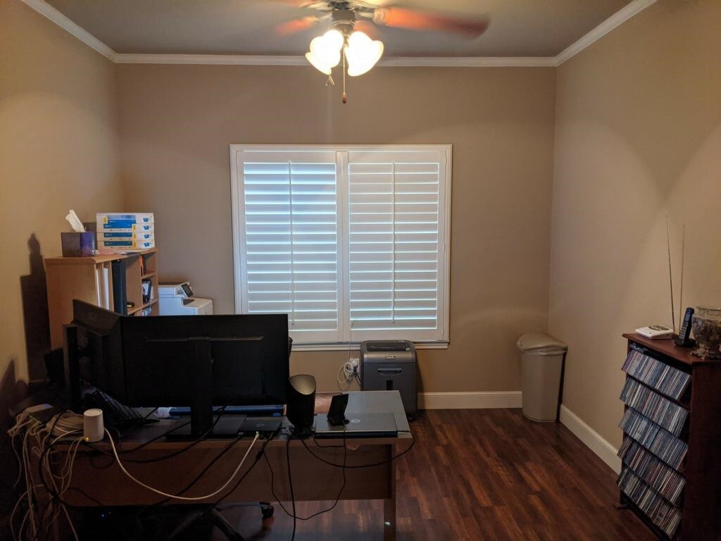 6120 75th Place Lubbock, TX 79424 - Photo 9 of 30 a view of a workspace with furniture and a window