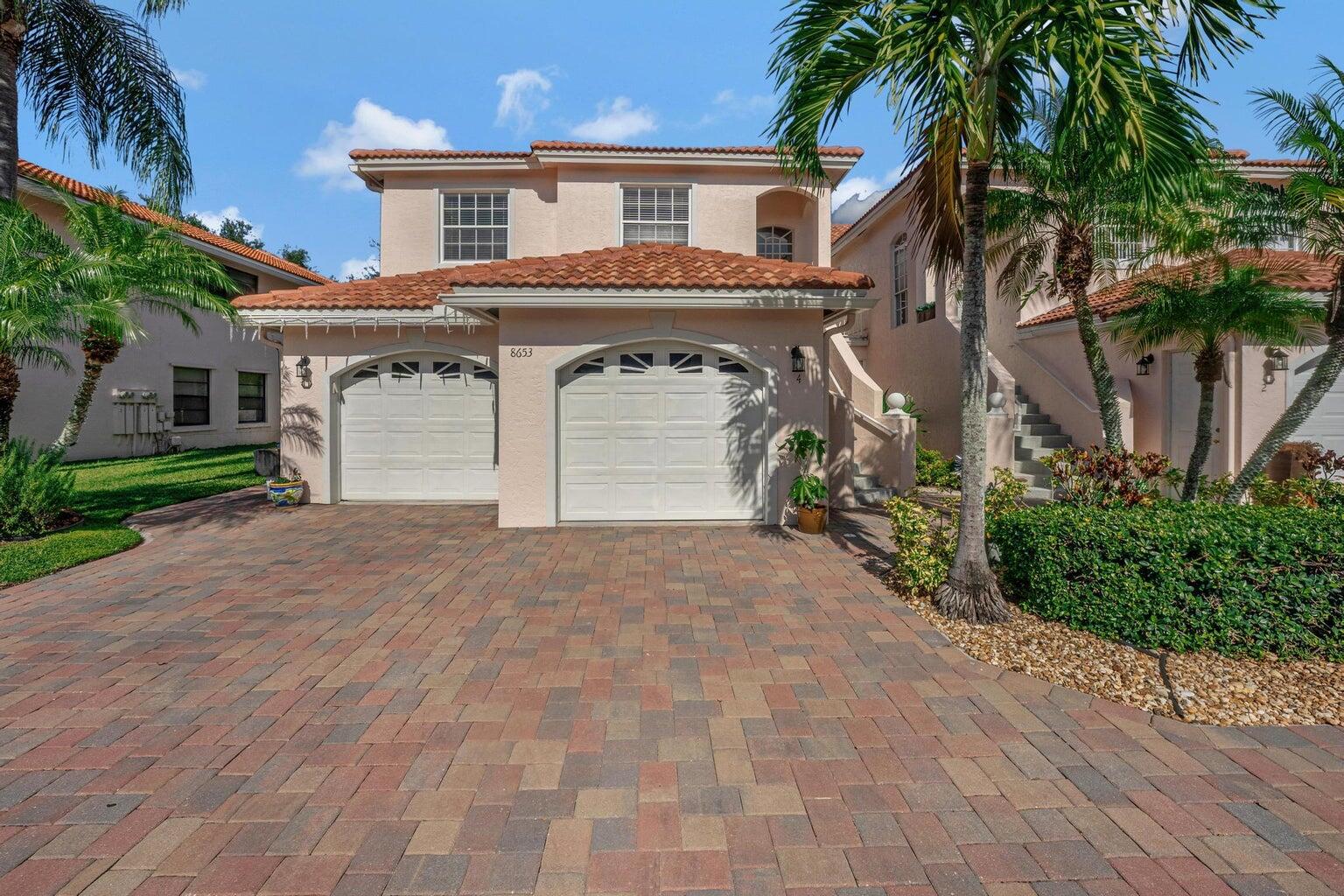 8653 Vía Reale, Unit 49U Boca Raton, FL 33496 - Photo 1 of 44 FRONT OF THE HOUSE