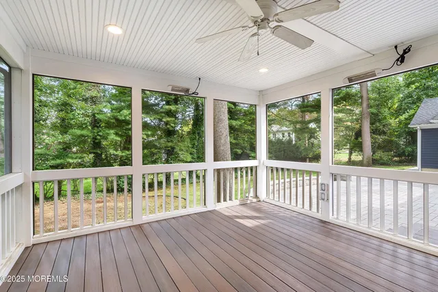 a view of a balcony with wooden floor