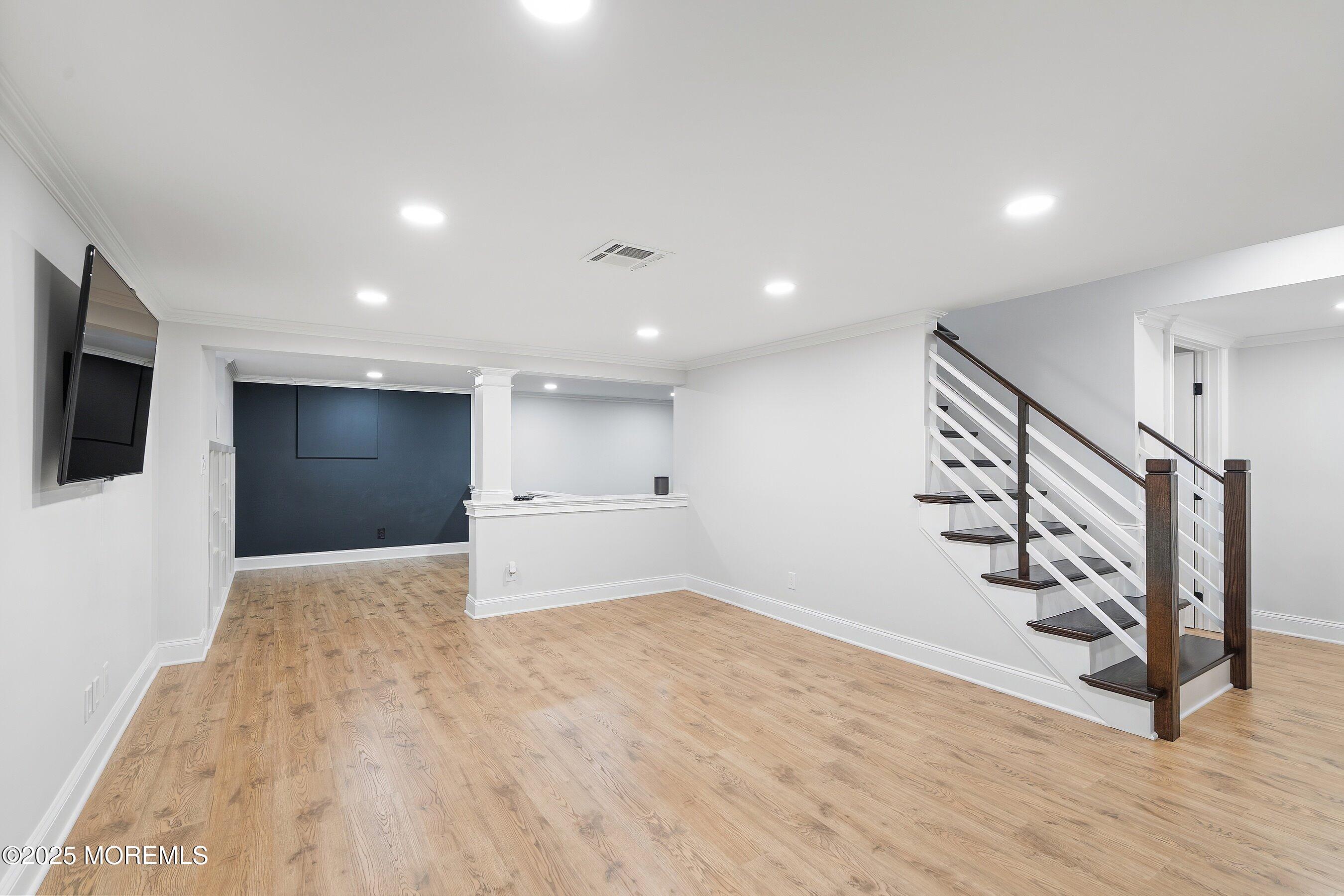 20 Rustic Terrace Fair Haven, NJ 07704 - Photo 24 of 32 a view of an empty room with wooden floor and stairs