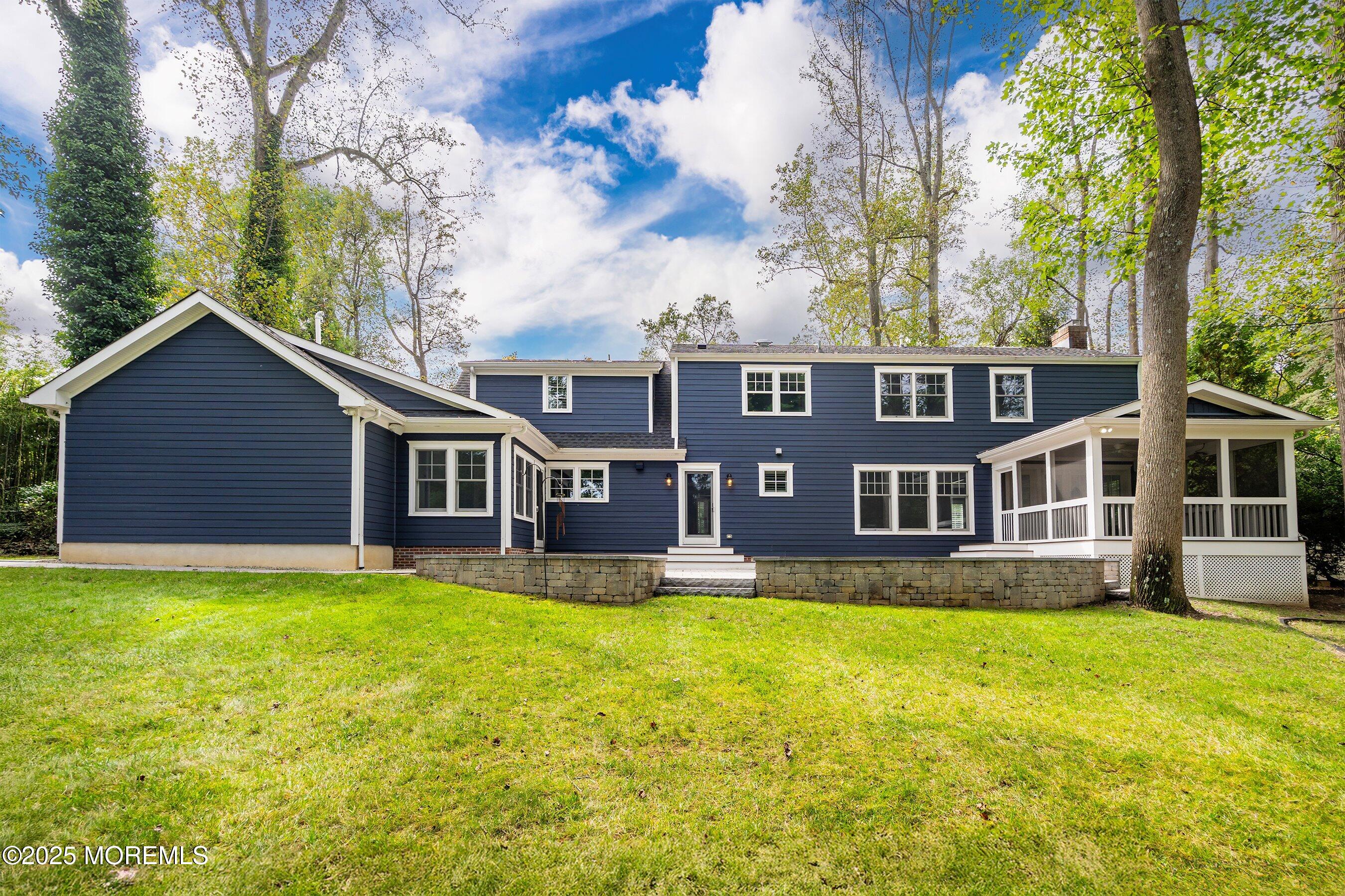 20 Rustic Terrace Fair Haven, NJ 07704 - Photo 28 of 32 a view of a house with a yard and sitting area