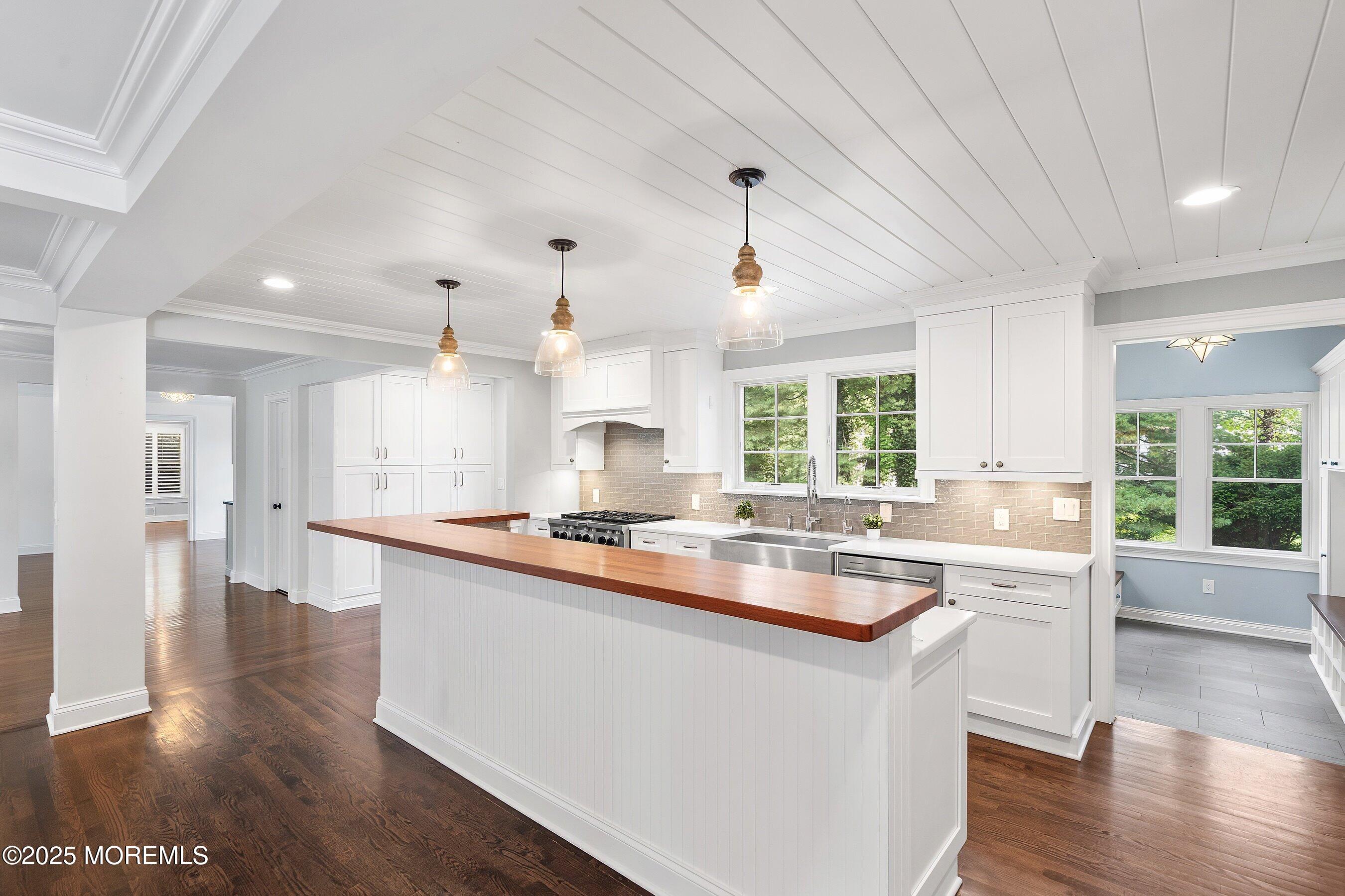 20 Rustic Terrace Fair Haven, NJ 07704 - Photo 5 of 32 a kitchen with a sink stove and wooden floor