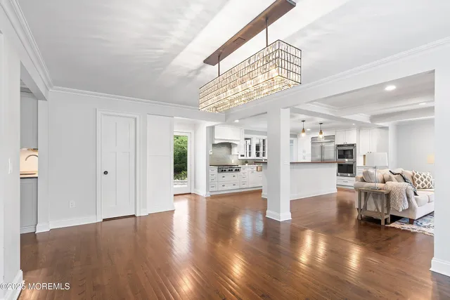 a view of a livingroom with furniture and wooden floor