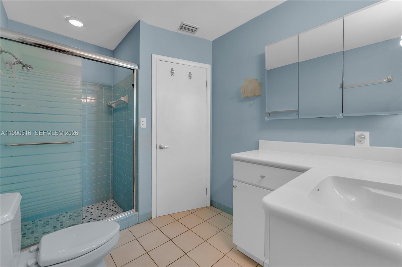 10020 Southwest 102nd Ave Road Miami, FL 33176 - Photo 14 of 27 a bathroom with a sink a toilet and shower