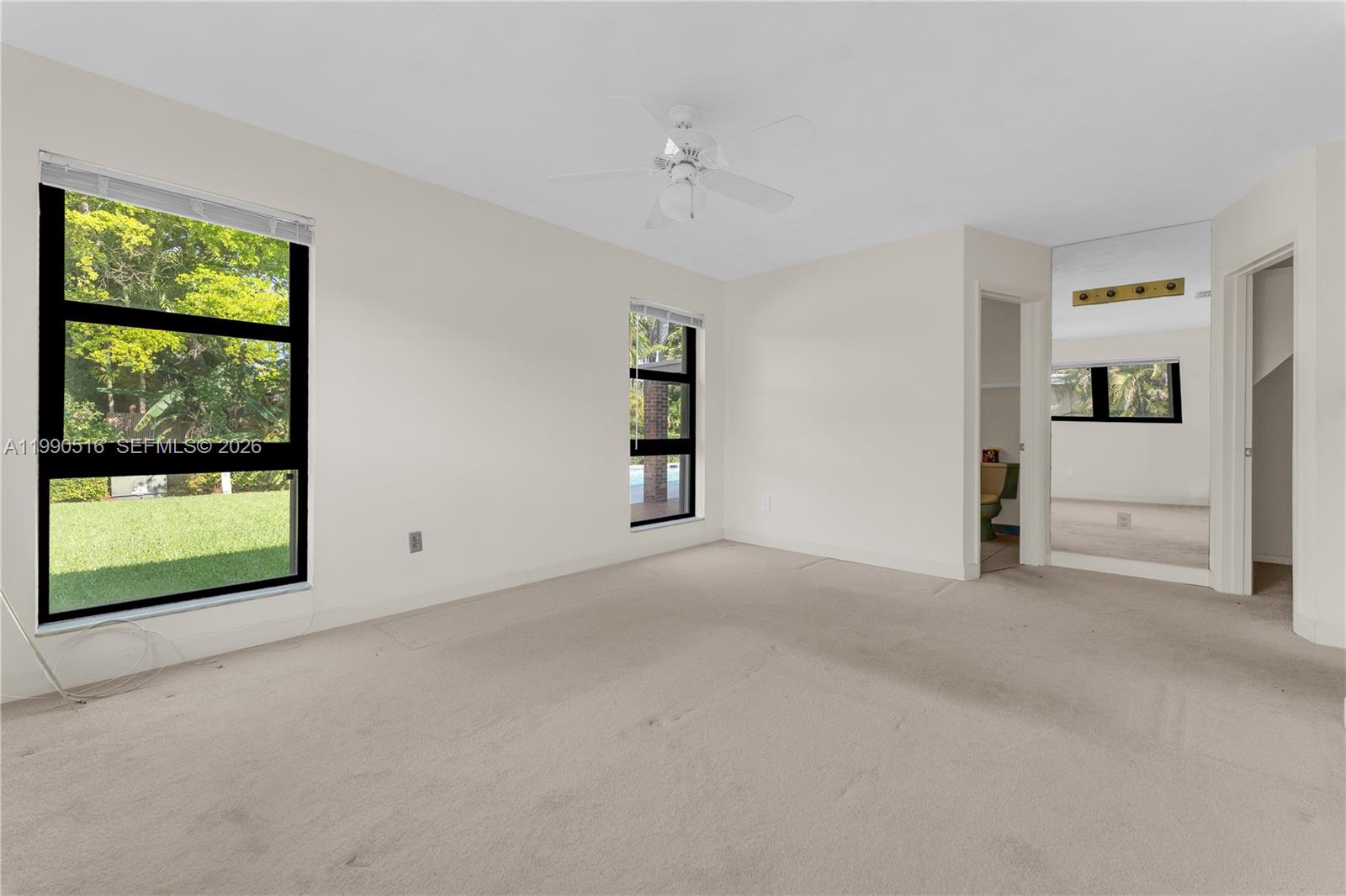 10020 Southwest 102nd Ave Road Miami, FL 33176 - Photo 15 of 27 an empty room with windows and closet