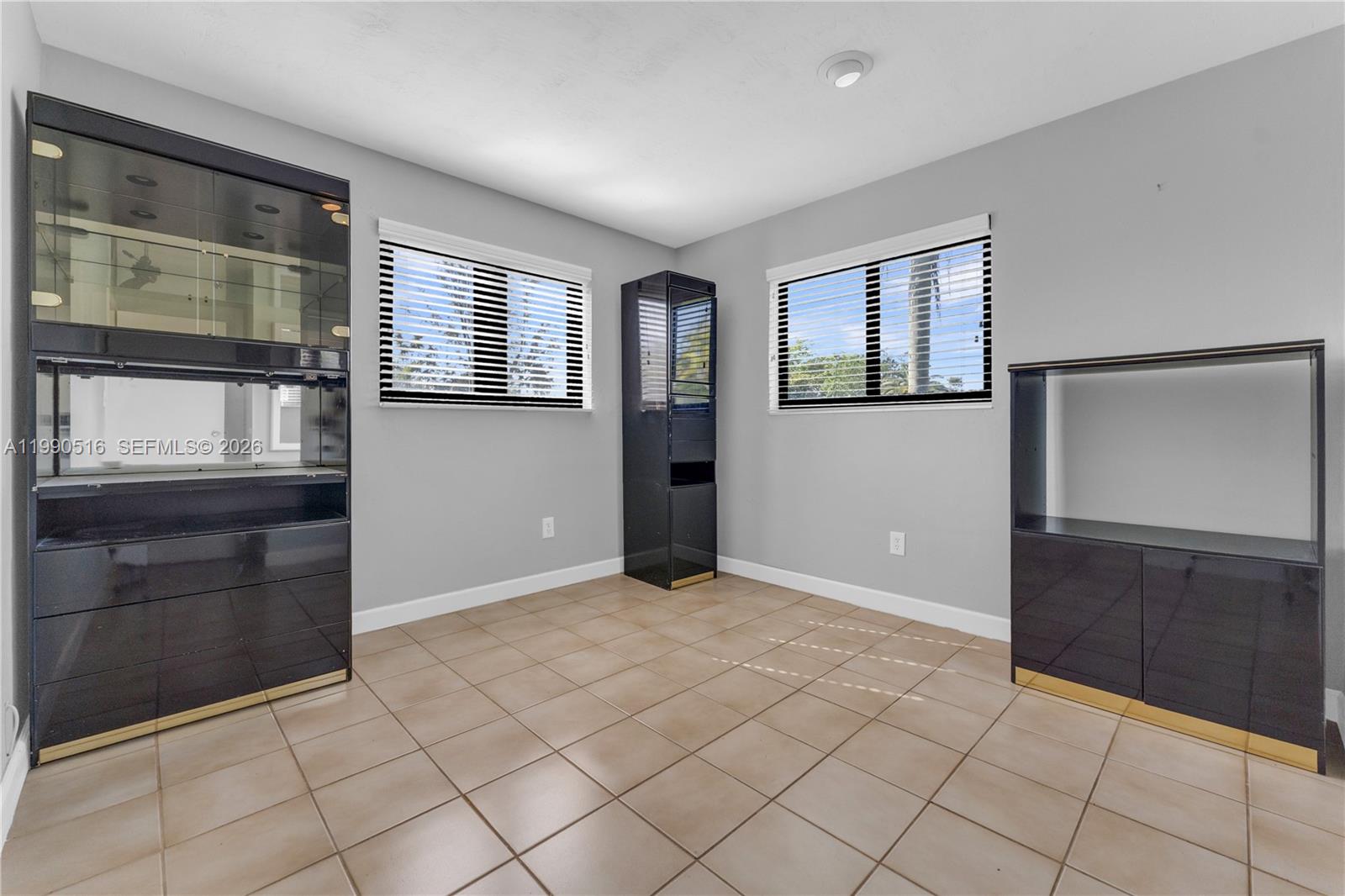 10020 Southwest 102nd Ave Road Miami, FL 33176 - Photo 19 of 27 an empty room with windows