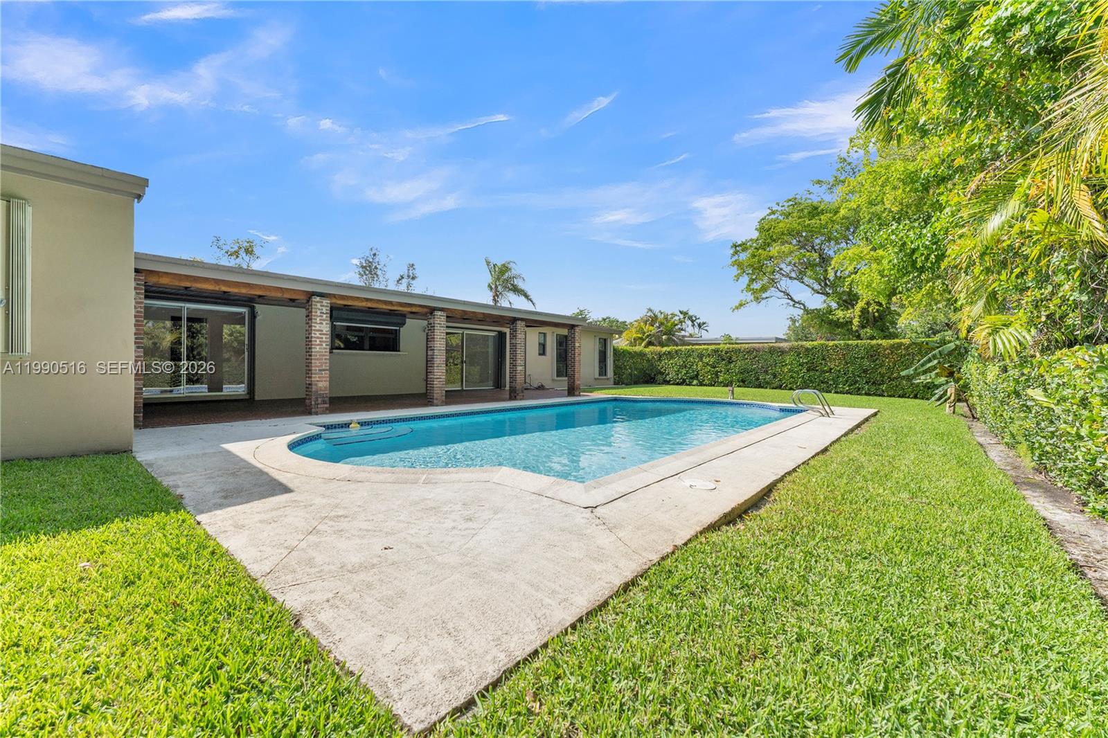 10020 Southwest 102nd Ave Road Miami, FL 33176 - Photo 23 of 27 a view of a house with a yard
