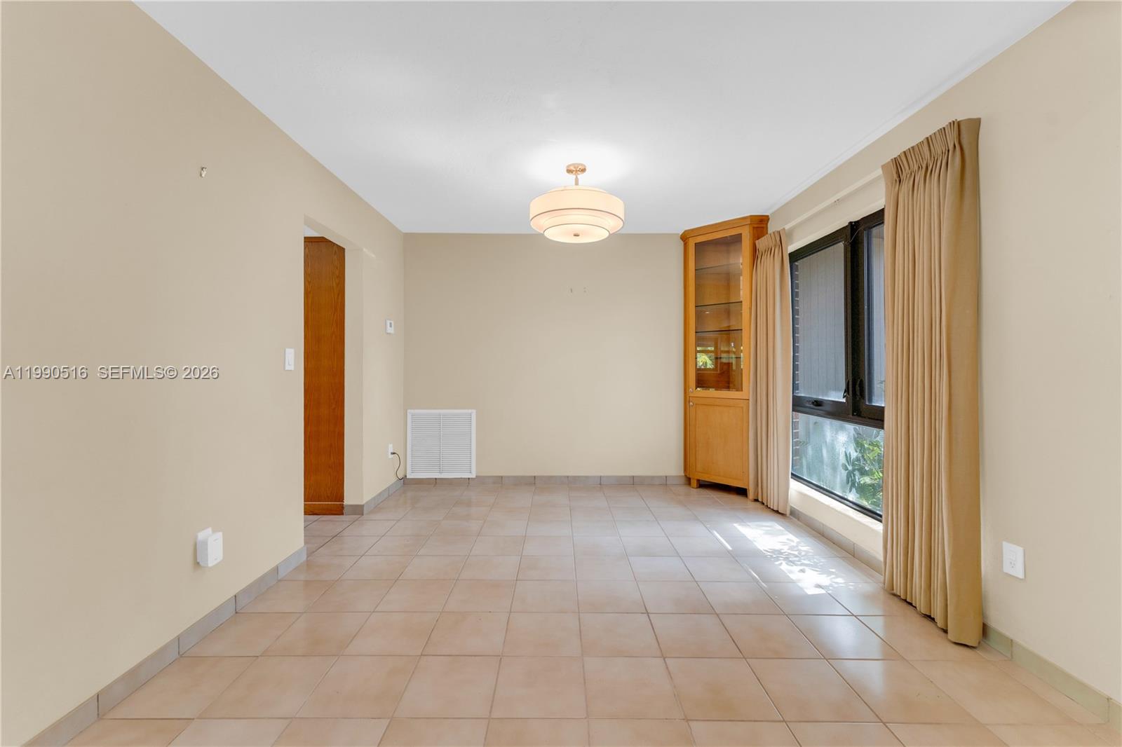 10020 Southwest 102nd Ave Road Miami, FL 33176 - Photo 5 of 27 an empty room with closet and a chandelier fan