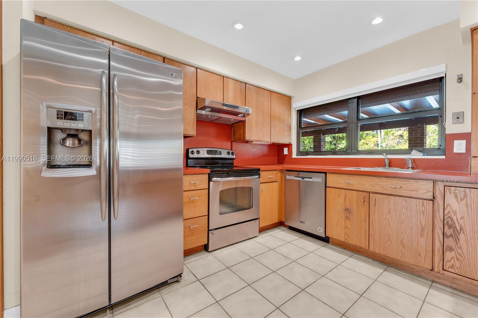 10020 Southwest 102nd Ave Road Miami, FL 33176 - Photo 7 of 27 a kitchen with stainless steel appliances a refrigerator sink and cabinets