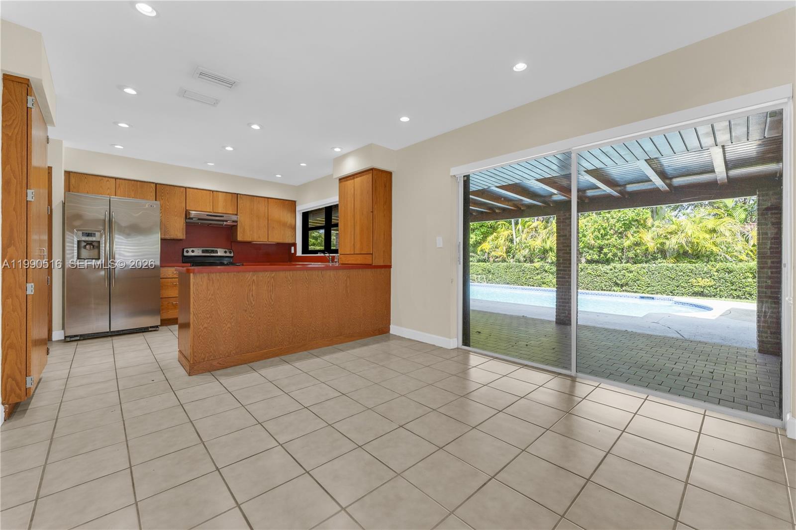 10020 Southwest 102nd Ave Road Miami, FL 33176 - Photo 8 of 27 a view of kitchen with refrigerator and window