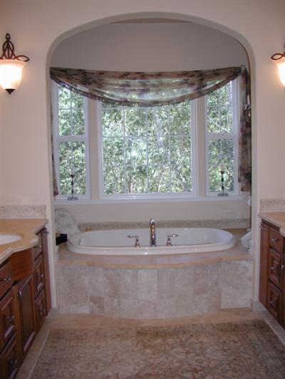 980 Quietwater Road Santa Rosa, CA 95404 - Photo 8 of 11 a bath tub sitting in a bathroom next to a window