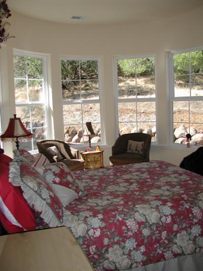 980 Quietwater Road Santa Rosa, CA 95404 - Photo 9 of 11 a living room with furniture floor and large windows