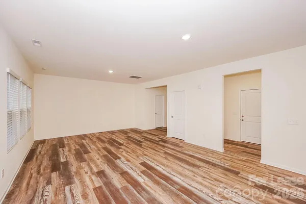 a view of kitchen with kitchen island sink and center island
