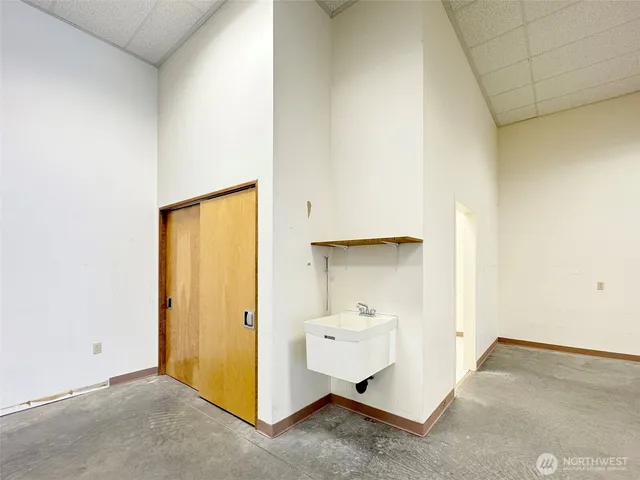 a view of a hall with a staircase