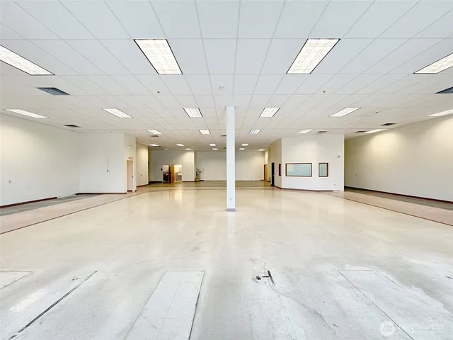 a view of a big room with an entryway