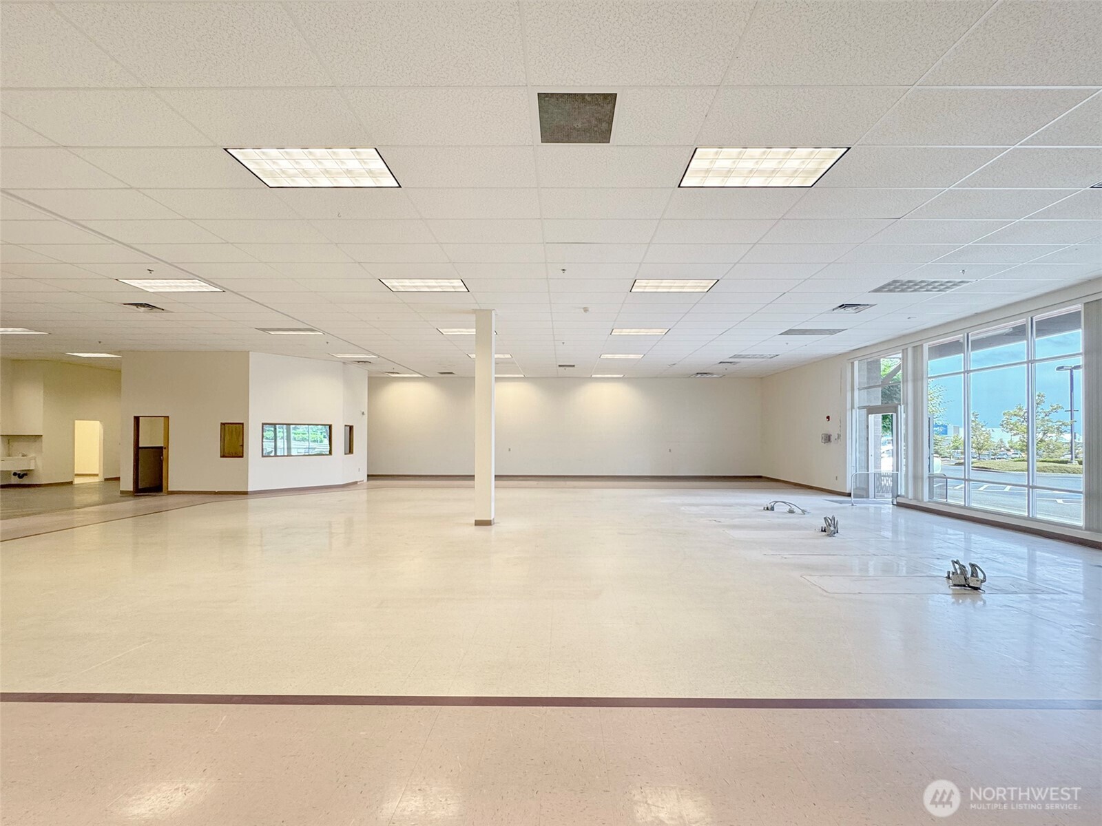 1400 West Washington Street, Unit 105 Sequim, WA 98382 - Photo 6 of 34 a large white kitchen with a large window