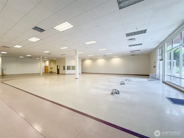 a view of a living room a refrigerator and a window