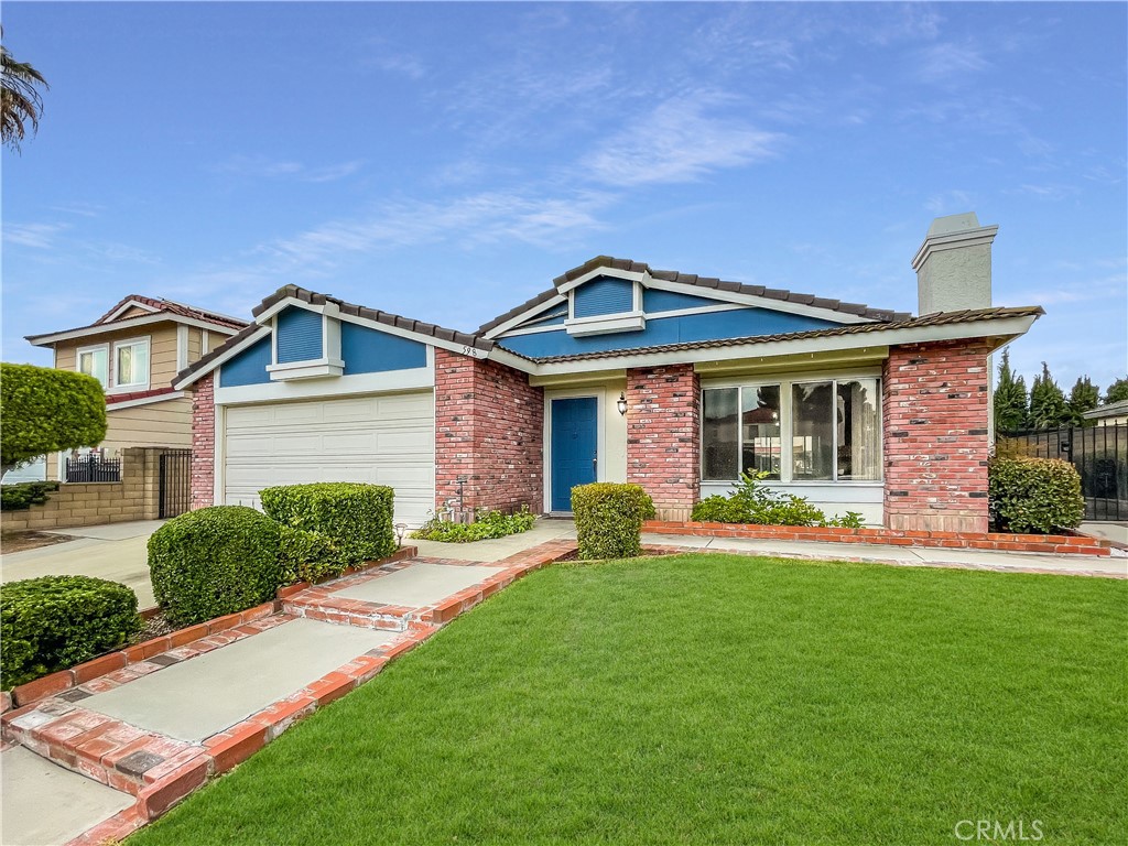 598 Armitos Place Diamond Bar, CA 91765 - Photo 1 of 26 a front view of a house with a yard