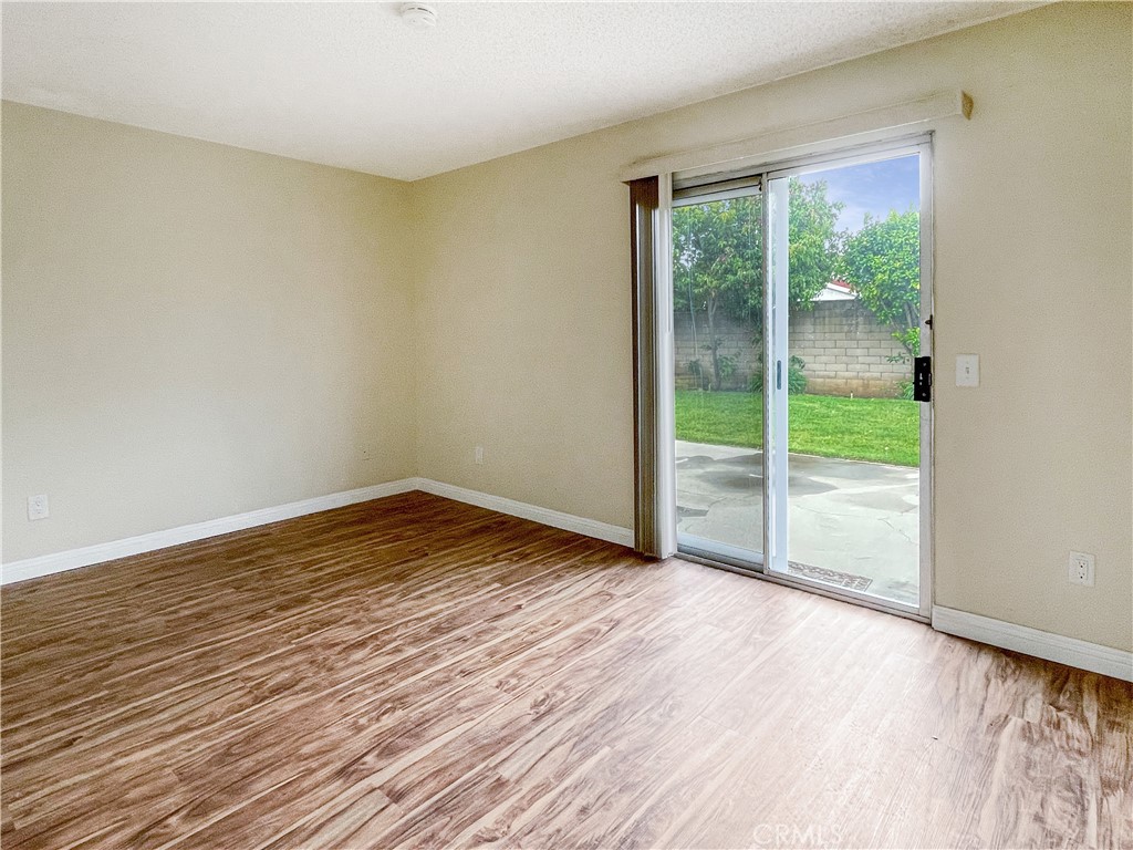 598 Armitos Place Diamond Bar, CA 91765 - Photo 12 of 26 a view of an empty room with wooden floor and a window