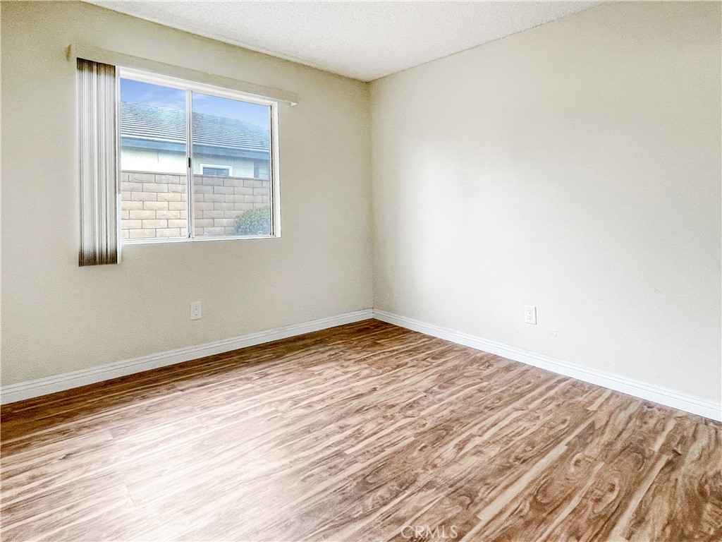 598 Armitos Place Diamond Bar, CA 91765 - Photo 15 of 26 an empty room with wooden floor and windows