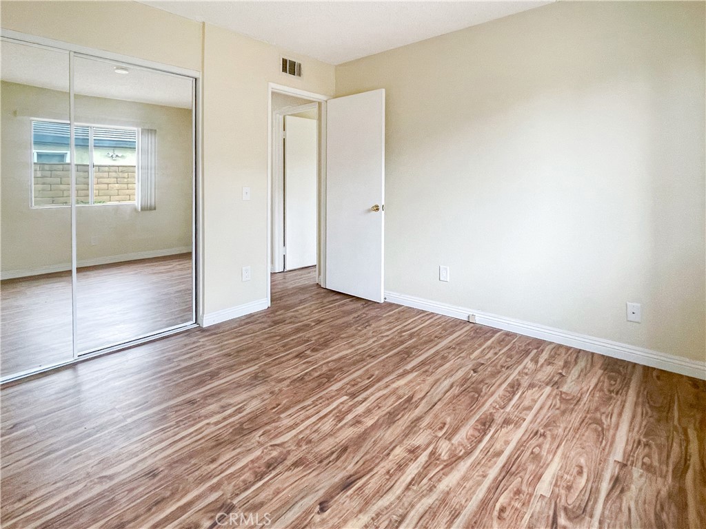 598 Armitos Place Diamond Bar, CA 91765 - Photo 16 of 26 an empty room with wooden floor and windows