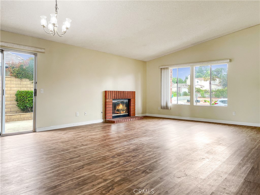 598 Armitos Place Diamond Bar, CA 91765 - Photo 4 of 26 an empty room with wooden floor and windows