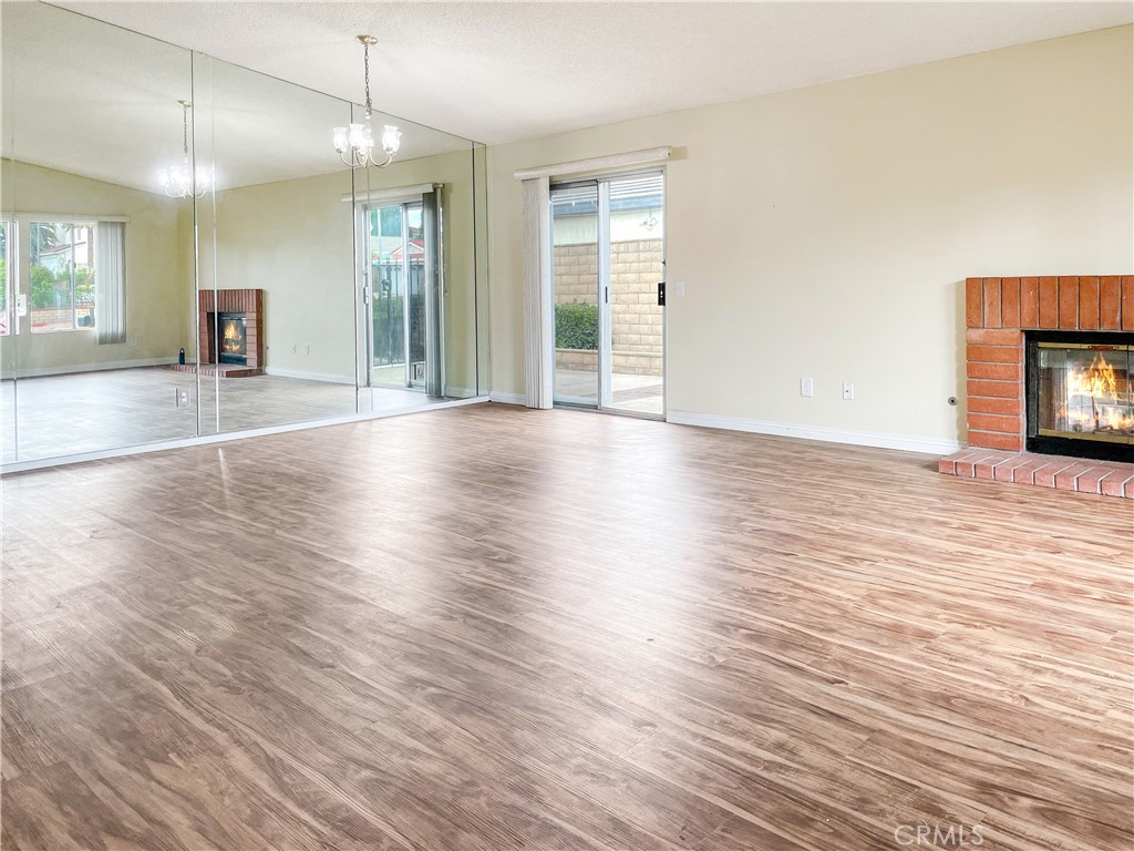 598 Armitos Place Diamond Bar, CA 91765 - Photo 5 of 26 an empty room with wooden floor and large windows