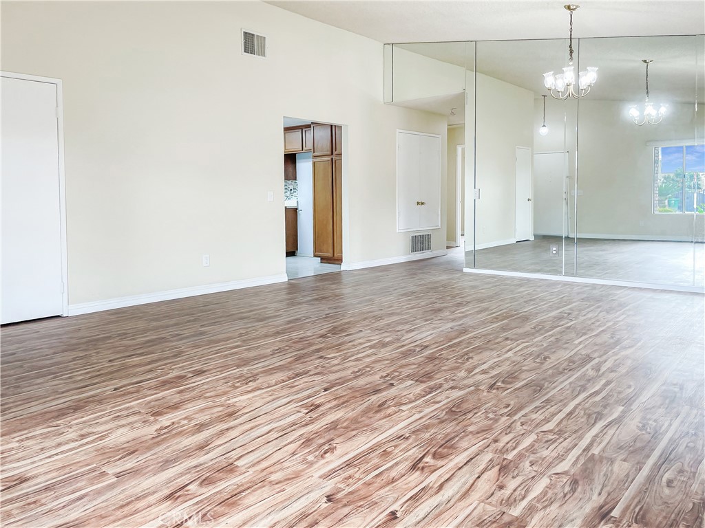 598 Armitos Place Diamond Bar, CA 91765 - Photo 6 of 26 an empty room with wooden floor and windows
