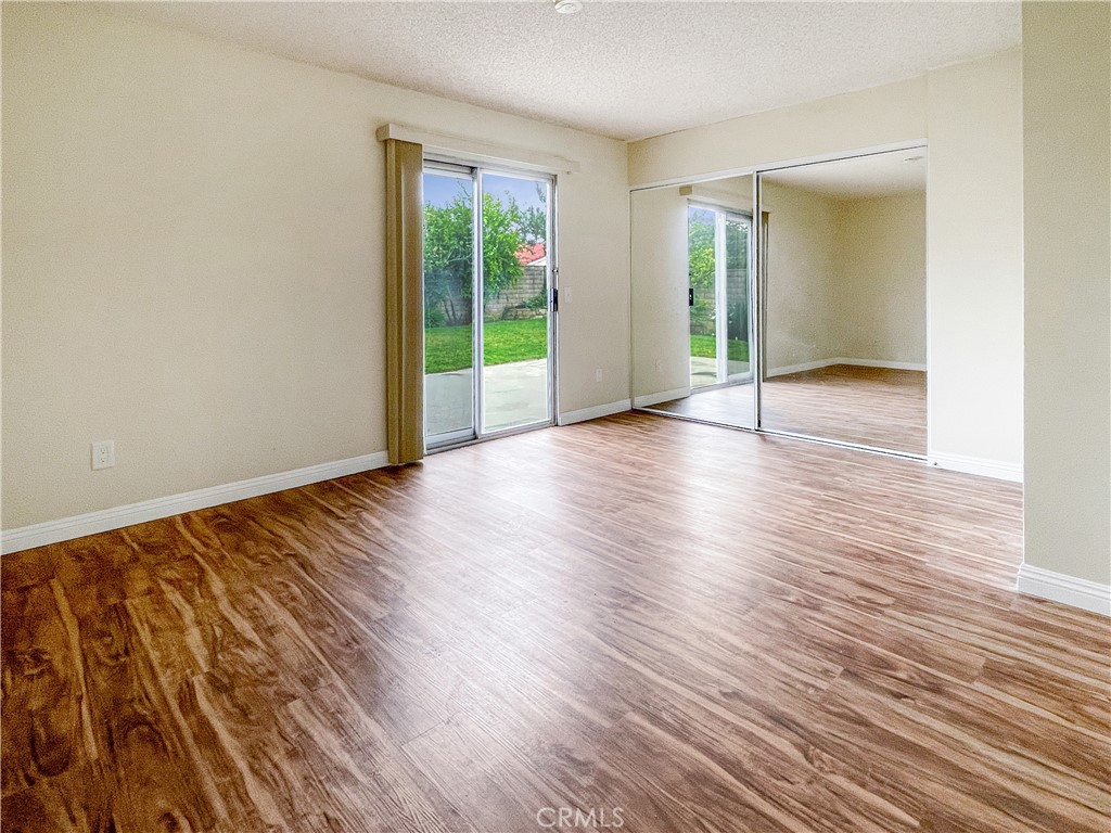 598 Armitos Place Diamond Bar, CA 91765 - Photo 9 of 26 an empty room with wooden floor and windows