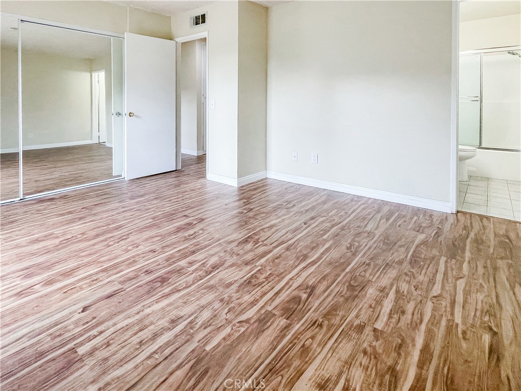 598 Armitos Place Diamond Bar, CA 91765 - Photo 10 of 26 a view of an empty room with wooden floor and a bathroom