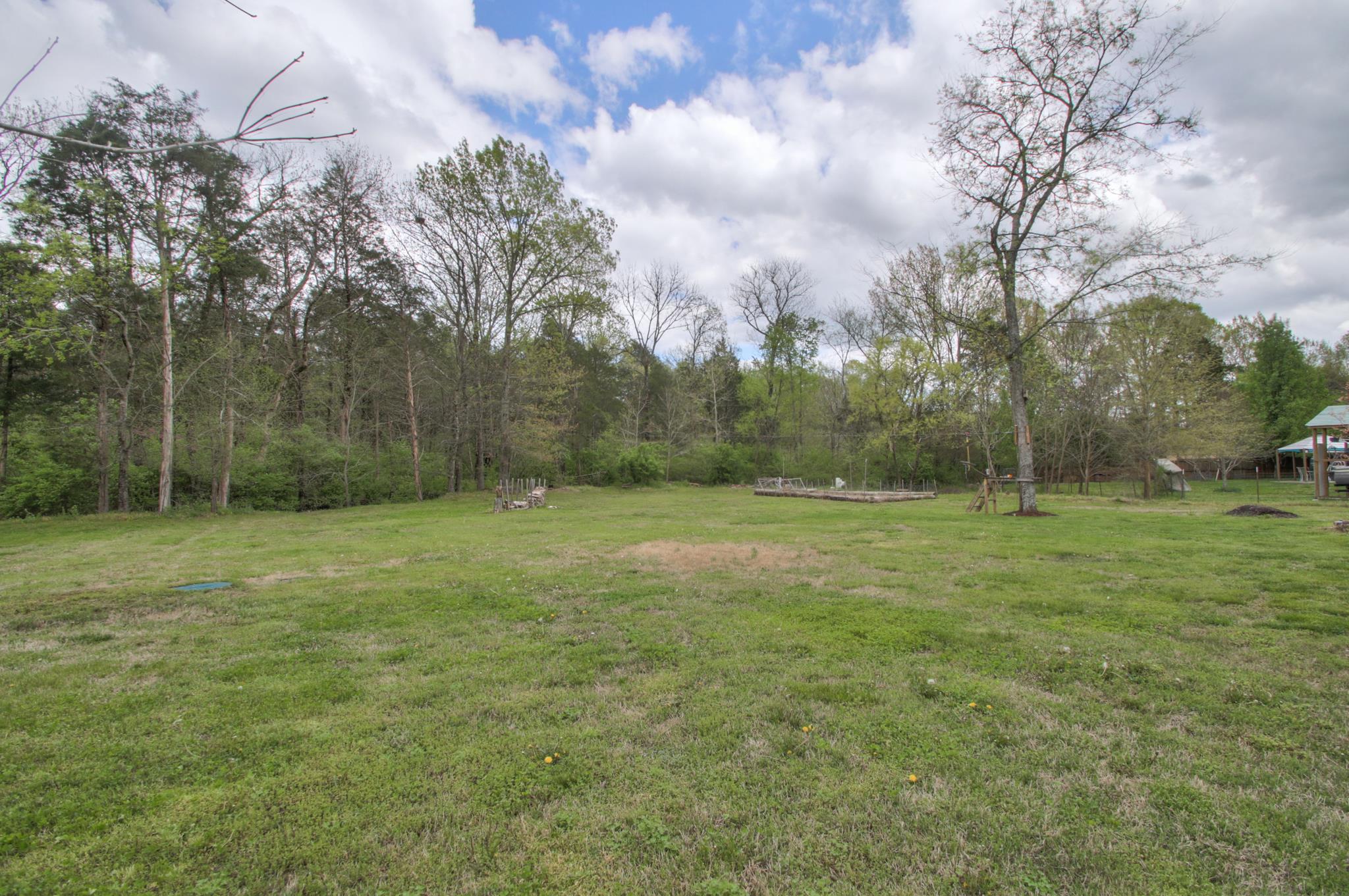 556 Windy Road Mount Juliet, TN 37122 - Photo 11 of 12 a view of a field with trees