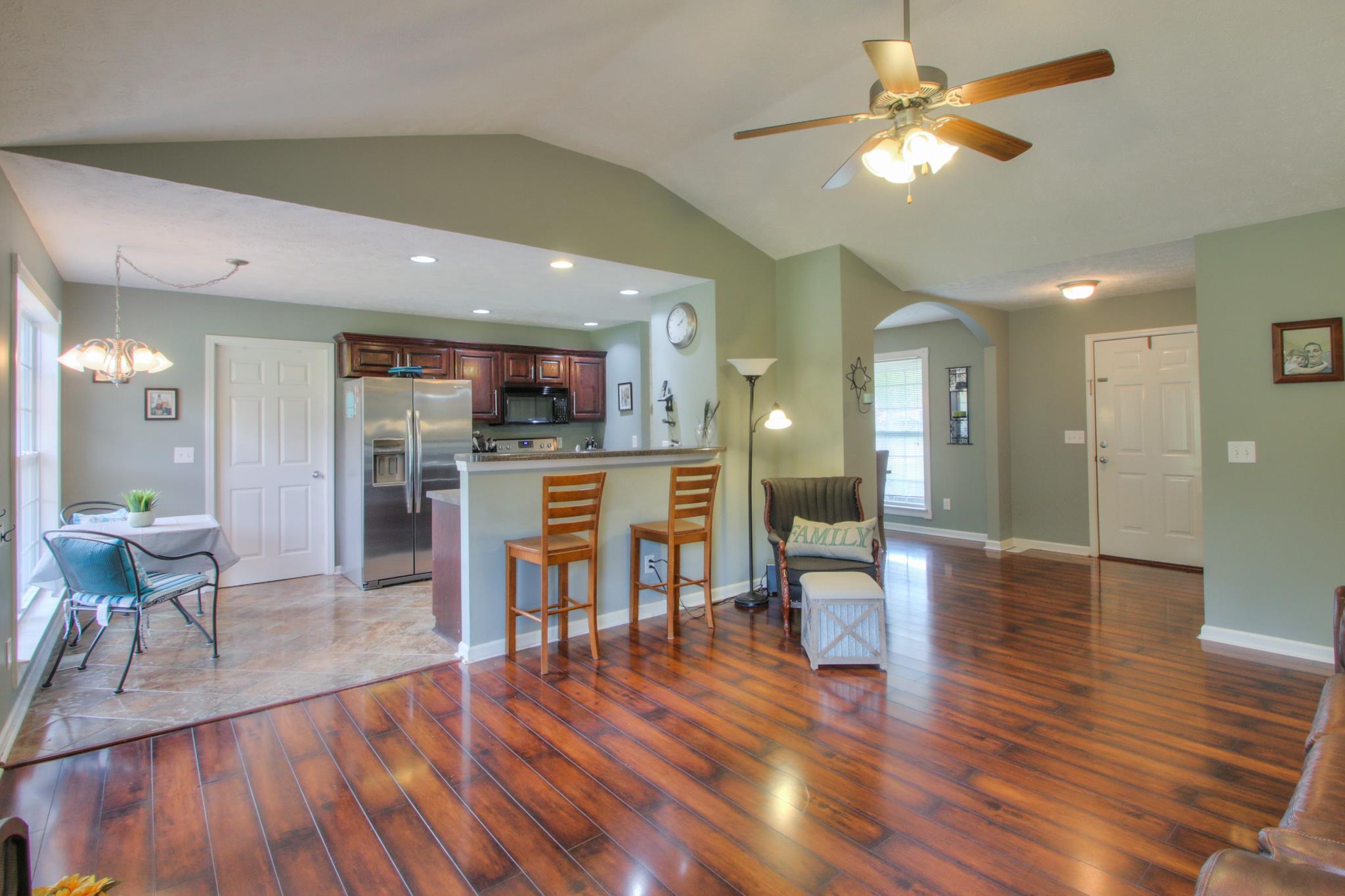 556 Windy Road Mount Juliet, TN 37122 - Photo 12 of 12 a view of a dining room with furniture and wooden floor