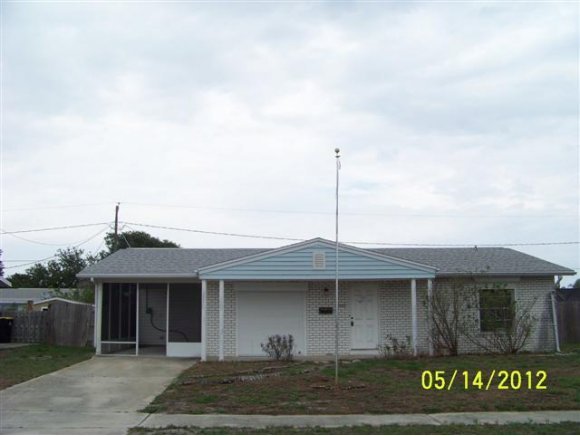 2959 Northeast Gemini Palm Bay, FL 32905 - Photo 1 of 12 a front view of a house with garden