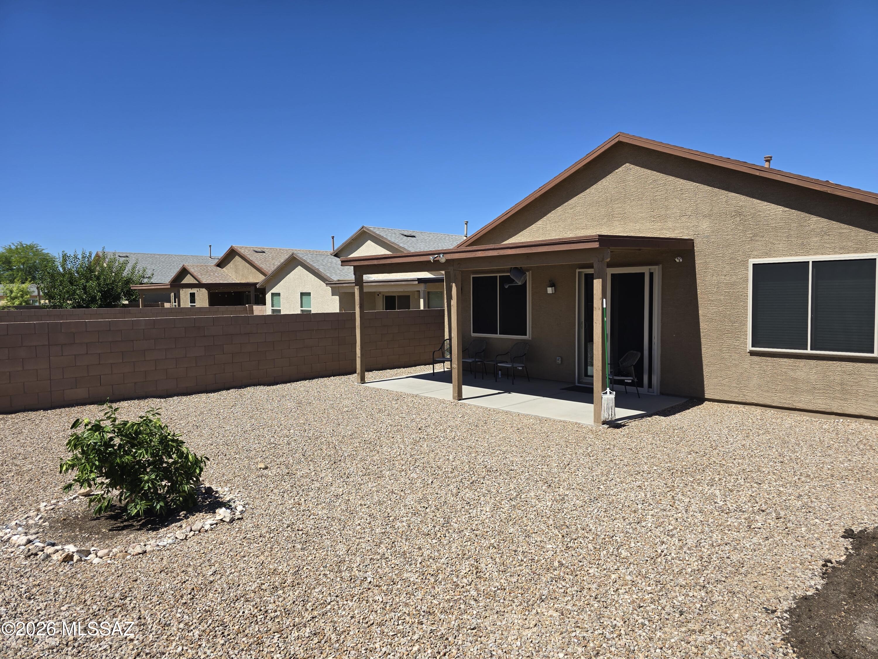 6151 South Antrim Loop Tucson, AZ 85706 - Photo 13 of 13 a front view of a house with a yard