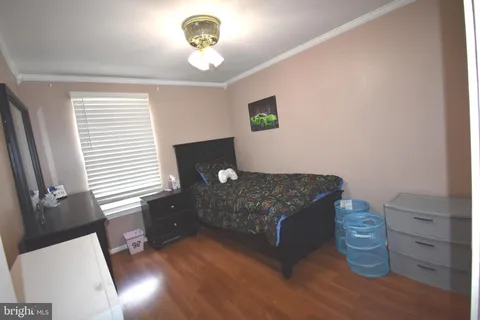 a bedroom with bed and a window