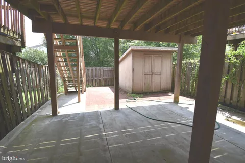 a view of backyard with a porch