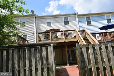 a view of a small yard with wooden fence