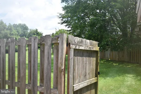 a view of backyard with small cabin