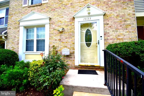 a front view of a house with a porch