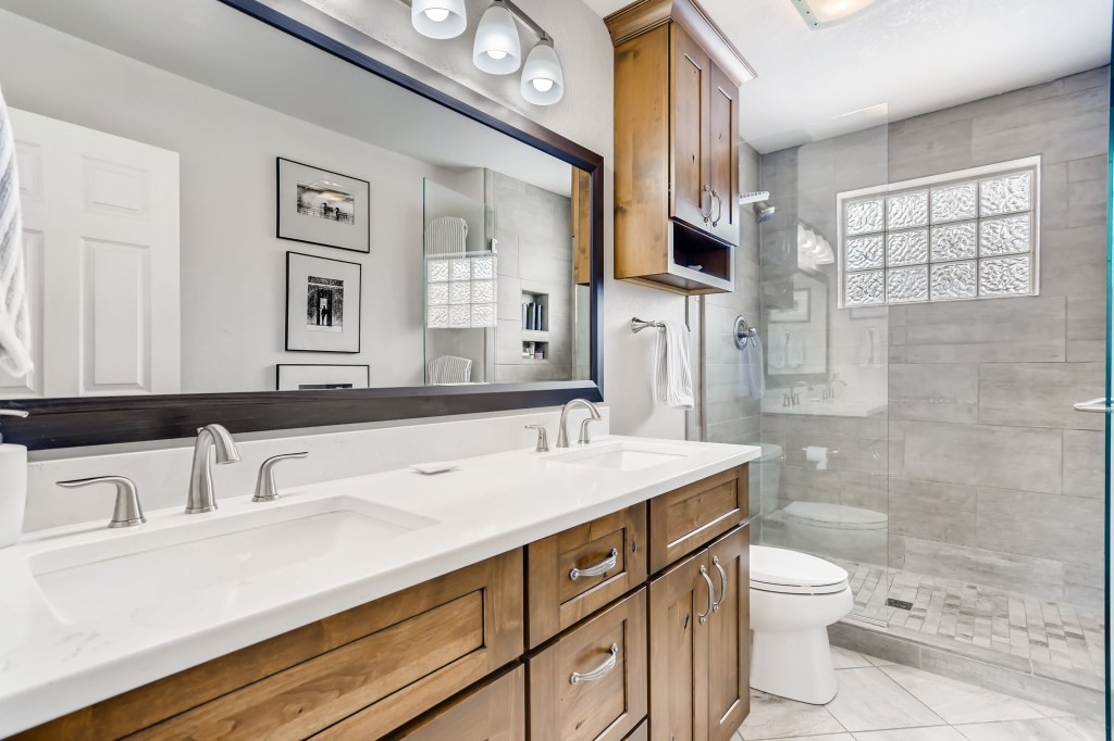 98 Lookout Ridge Drive, Unit 98 Dillon, CO 80435 - Photo 17 of 29 GREAT REMODELED MASTER BEDROOM with NEW COUNTER TOP, SINKS, FAUCETS, REMODELED SHOWER, NEW TILE FLOORING and NEW CABINETS...