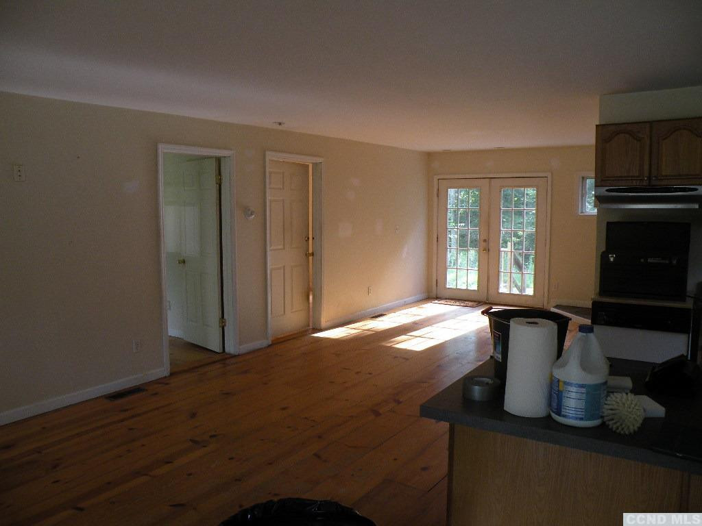 618 Bean River Road Pine Plains, NY 12546 - Photo 14 of 15 a view of an empty room with window and wooden floor