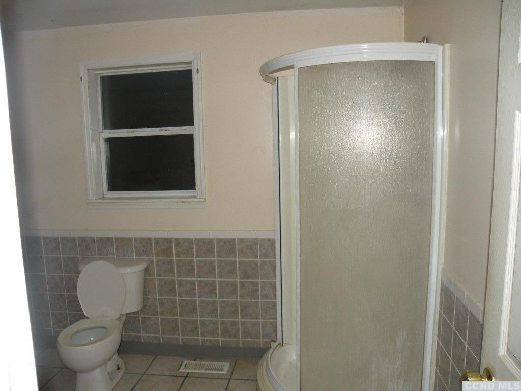 618 Bean River Road Pine Plains, NY 12546 - Photo 8 of 15 a bathroom with a toilet and a window