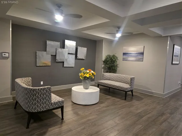 a living room with furniture and a chair