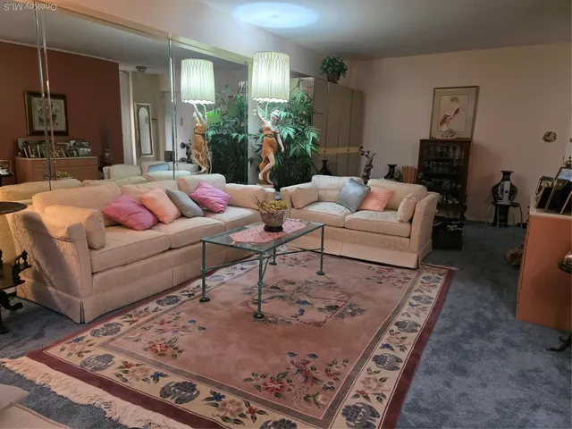 a living room with furniture and a rug